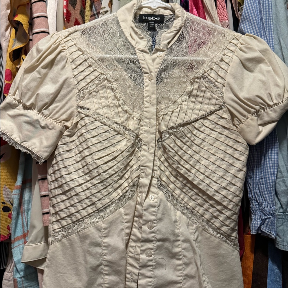 Cream colored, pleated, and lace blouse